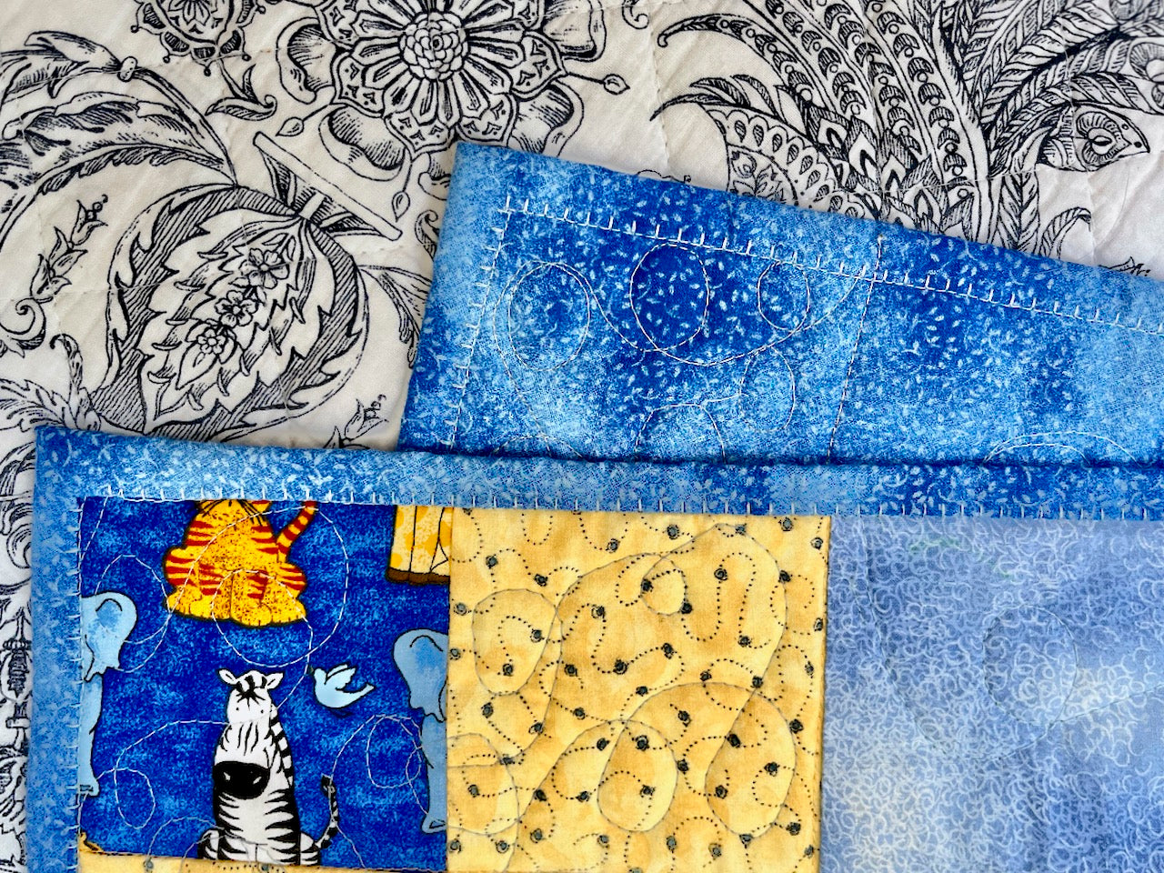 close up of baby quilt blanket stitch