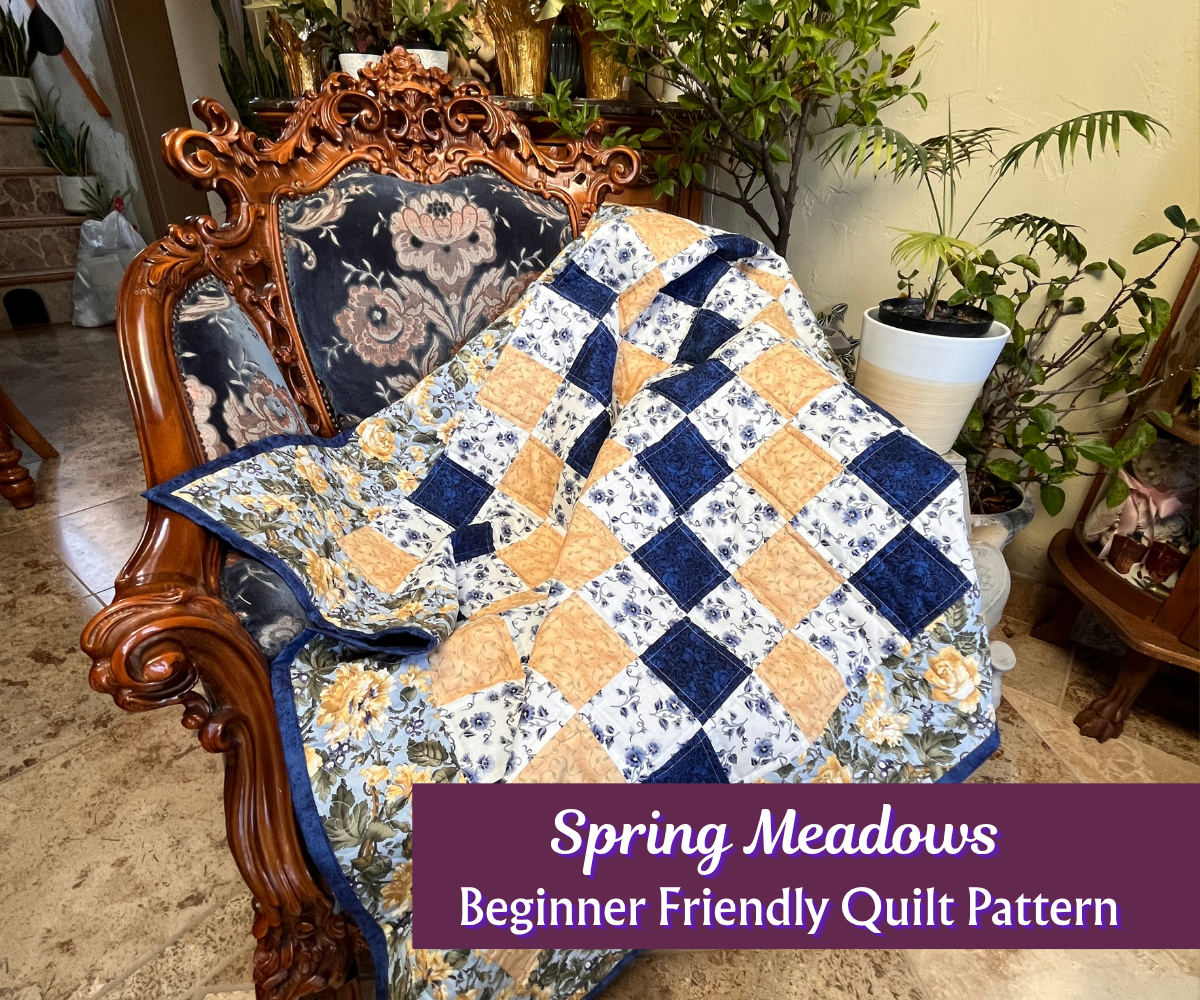 Quilt with blue and yellow diamond pattern draped over a wooden chair in a home setting.