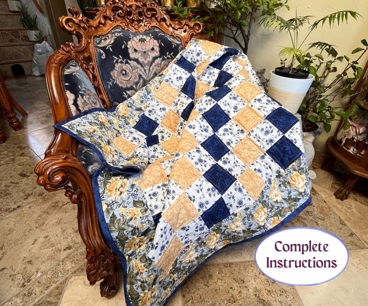 Decorative quilt with a checkered pattern draped over an ornate chair in a home setting.