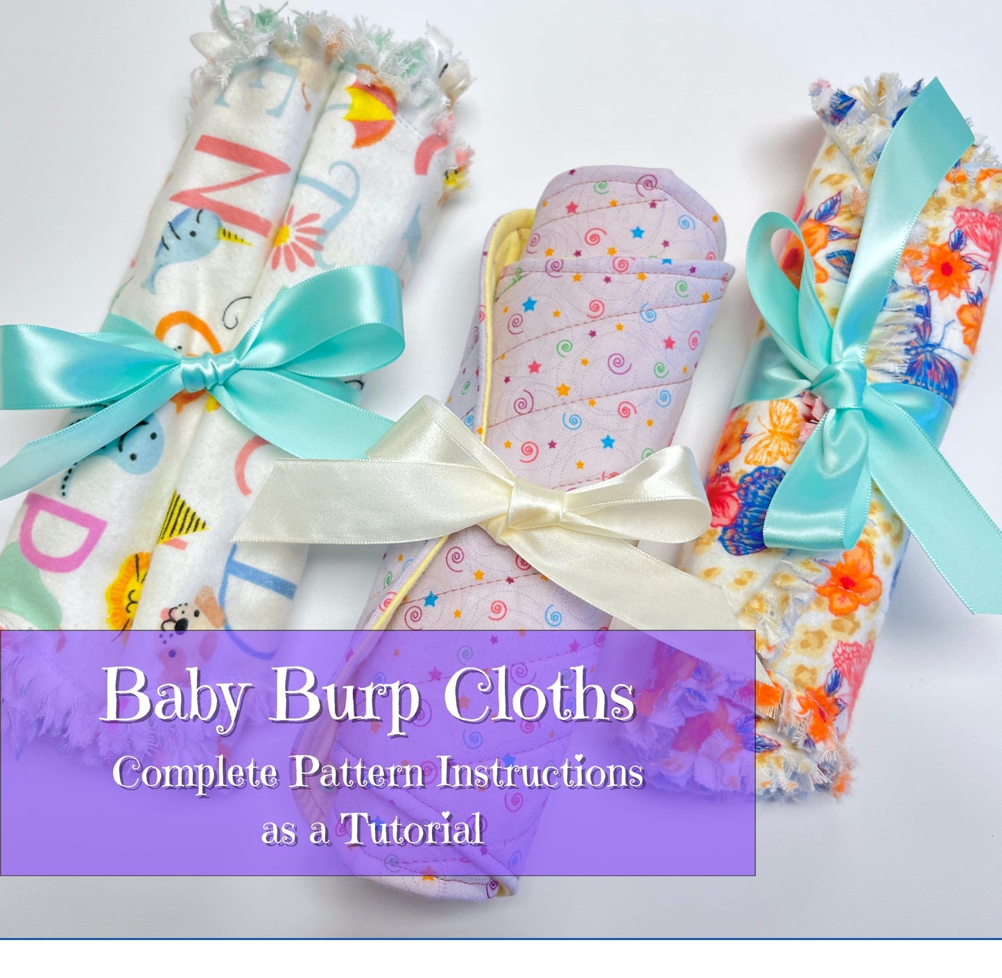 Three rolled baby burp cloths with colorful floral and patterned fabrics are tied with satin ribbons, with a purple text banner reading 'Baby Burp Cloths Complete Pattern Instructions as a Tutorial'.