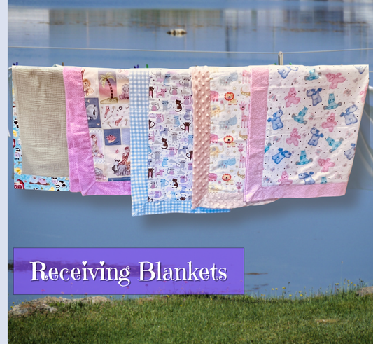 Four baby blankets with various patterns (gingham, cartoon animals, minky dot) and pink borders hanging on a clothesline outdoors in front of a blue lake. A purple banner at the bottom reads 'Receiving Blankets'.